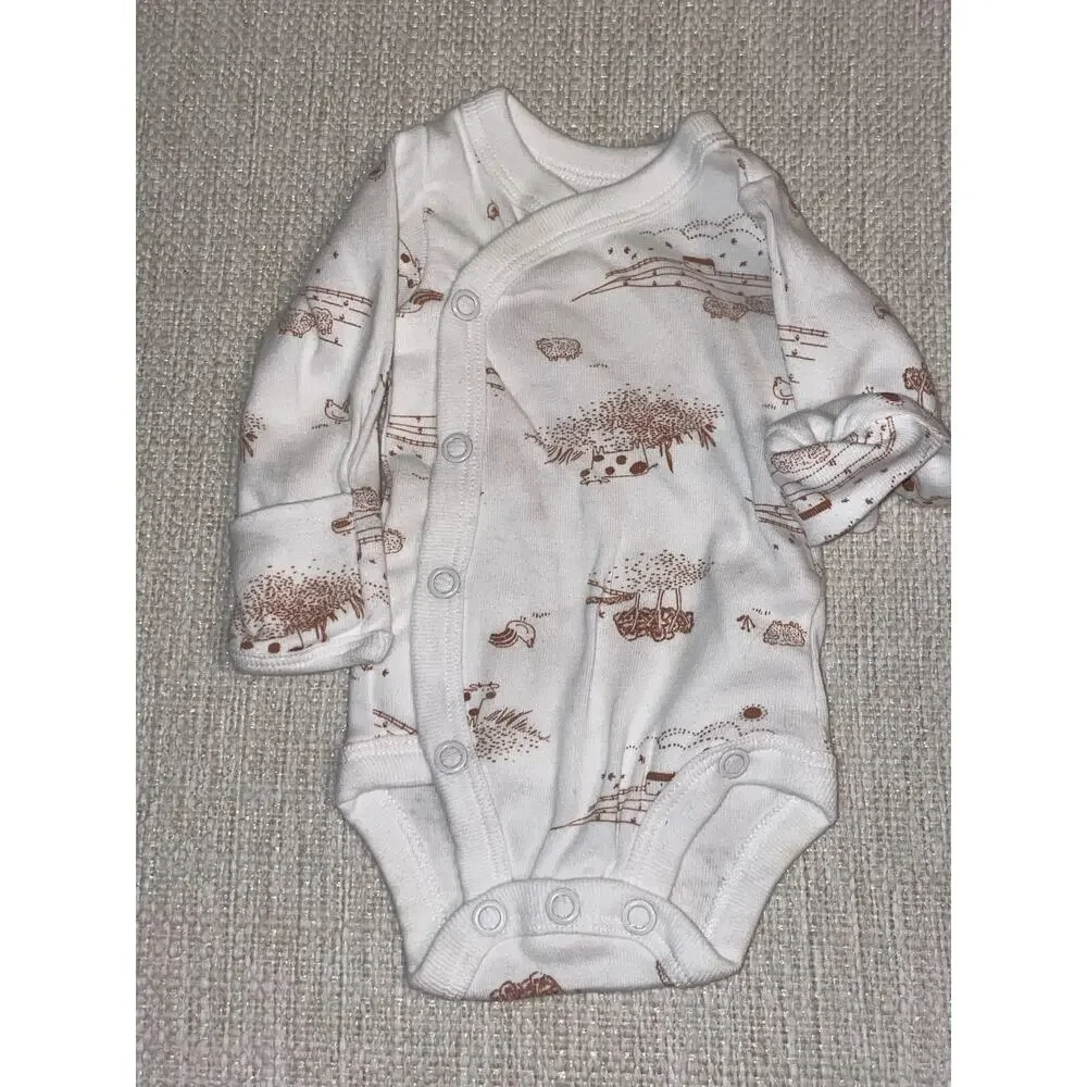 Carter’s Bundle of  4 (four) Preemie / newborn onesies.